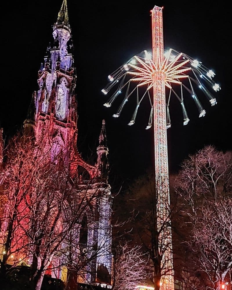 Star Flyer beside the illuminated Scott Monument during Christmas in Edinburgh